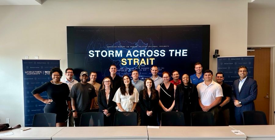 The full class assembled in front of the title screen at the end of the exercise.